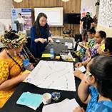 A group of people sitting around a table

AI-generated content may be incorrect.