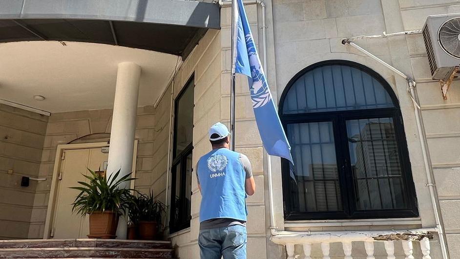 UNMHA The United Nations flag is lowered at a UN building in Yemen.