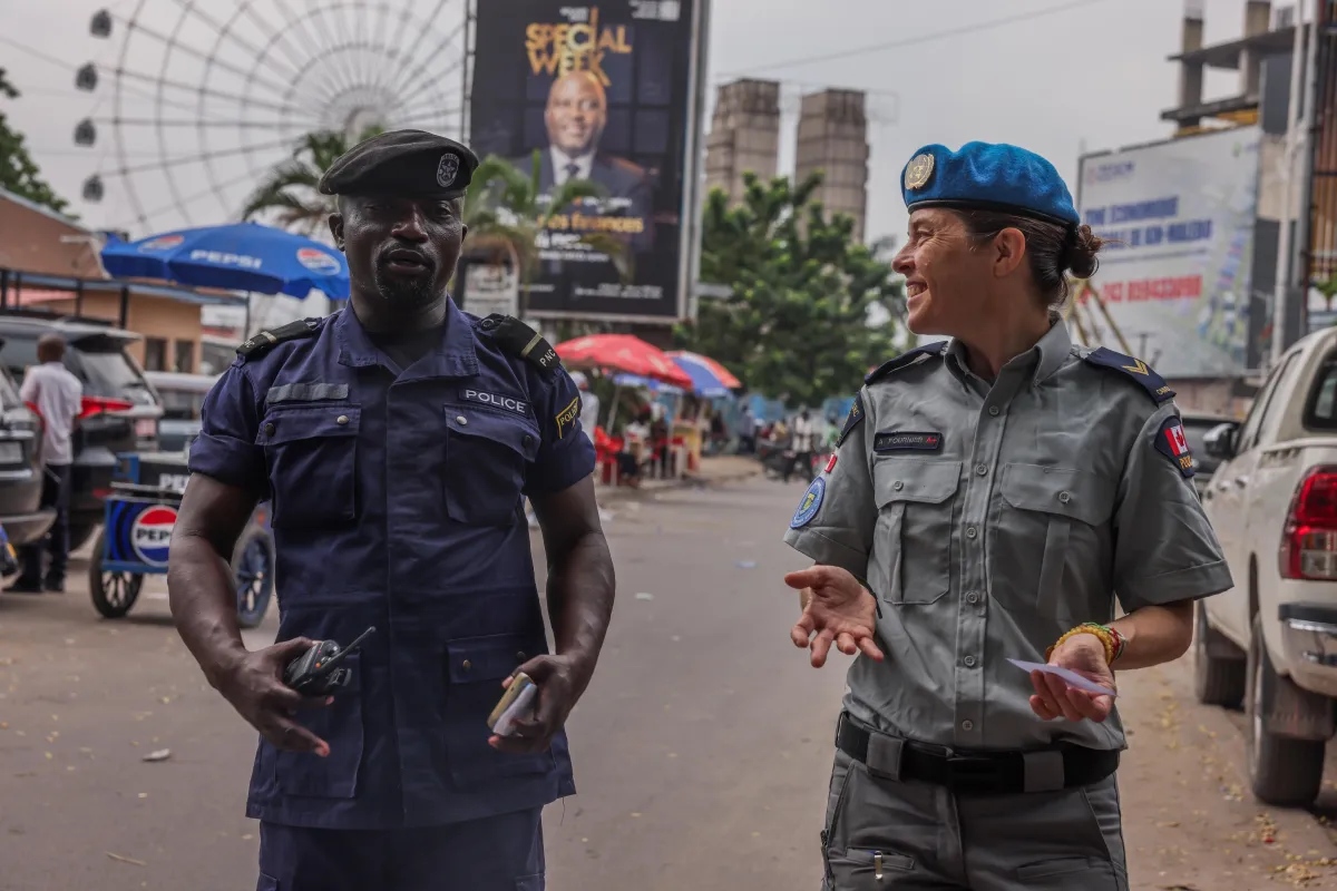 Two police officers engaging.